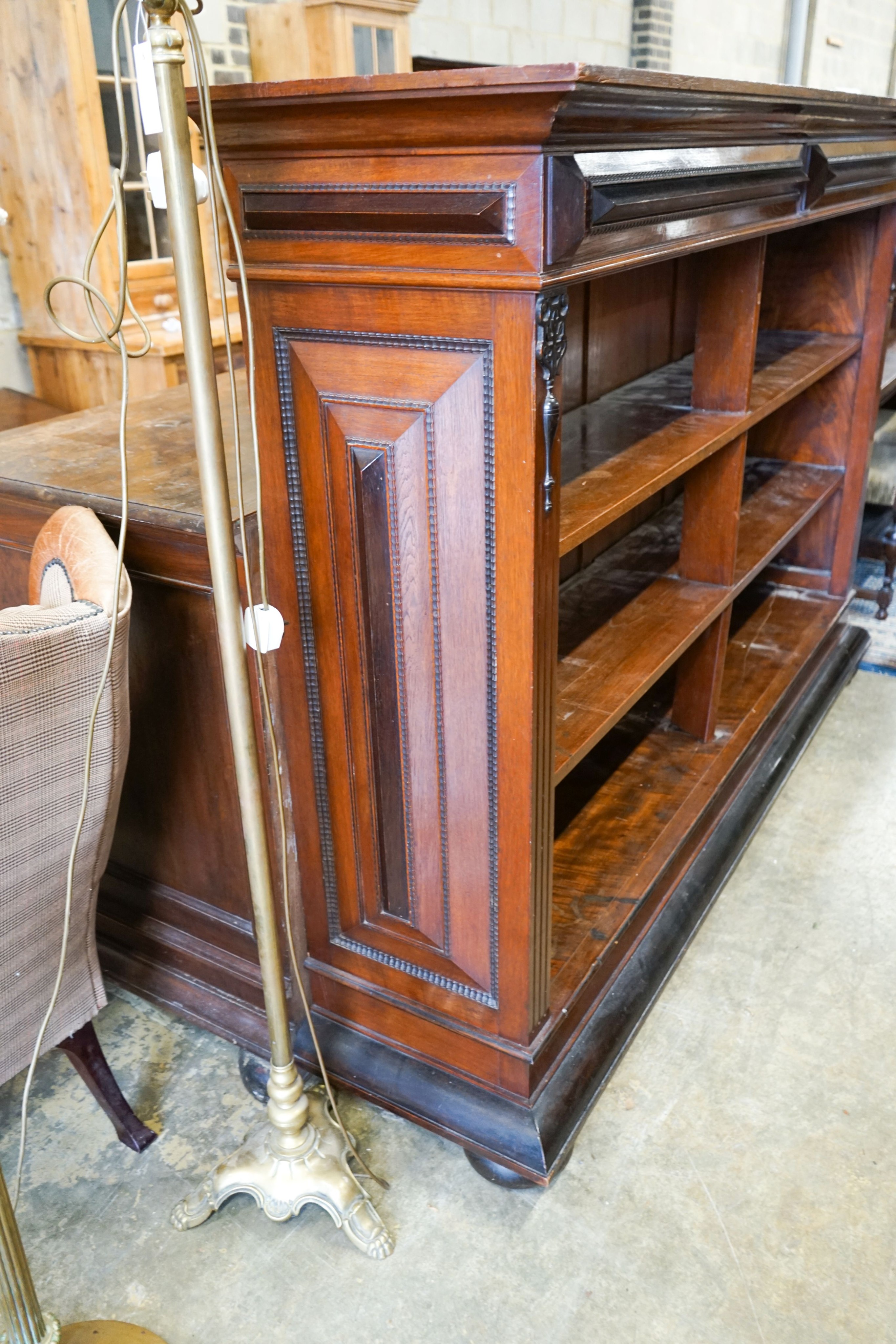 A 19th century Dutch mahogany and ebonised three-tier open bookcase of large proportions, length 216cm, depth 48cm, height 150cm